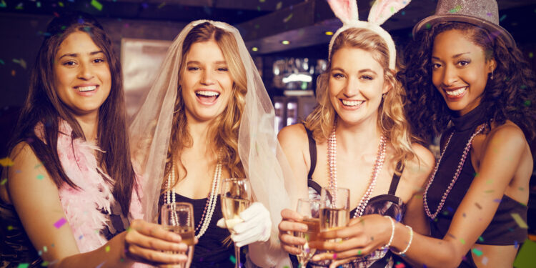 Friends celebrating bachelorette party against flying colours