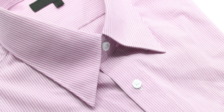 Why men-shirts have buttons on the other side than women-shirts